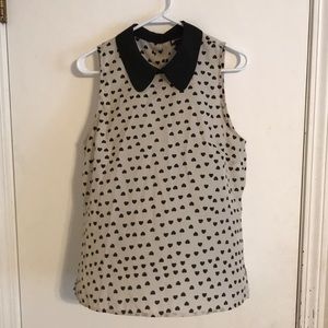 White sleeveless blouse with black hearts